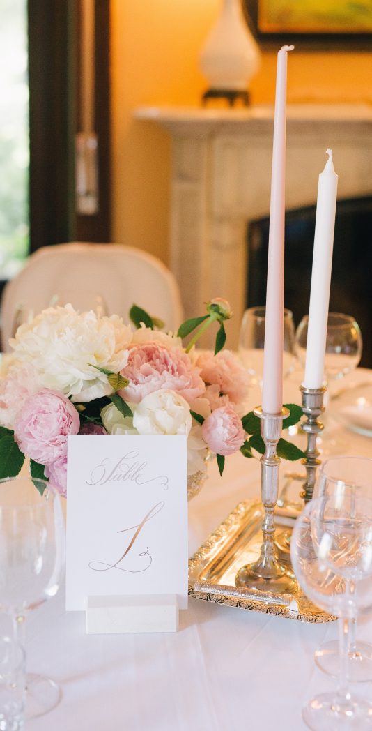 Candles and flowers on table at wedding